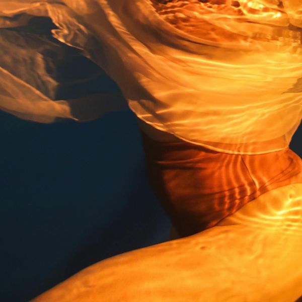 Abstract silhouette of a human body showing energy flow lines.